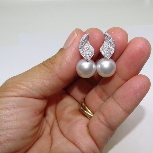 pendientes de oro blanco 0.61cts de diamantes y 2 perlas australianas de 11mm - Imagen 6