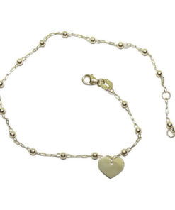 Tobillera de oro amarillo de 18k con cadena de eslabones y bolitas de 3mm con motivo de corazón.