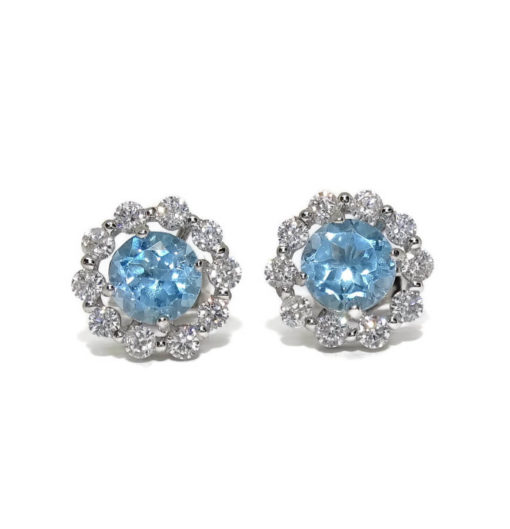 pendientes redondos de oro blanco de 18K con 20 circonitas blancas y 2 topacios azules