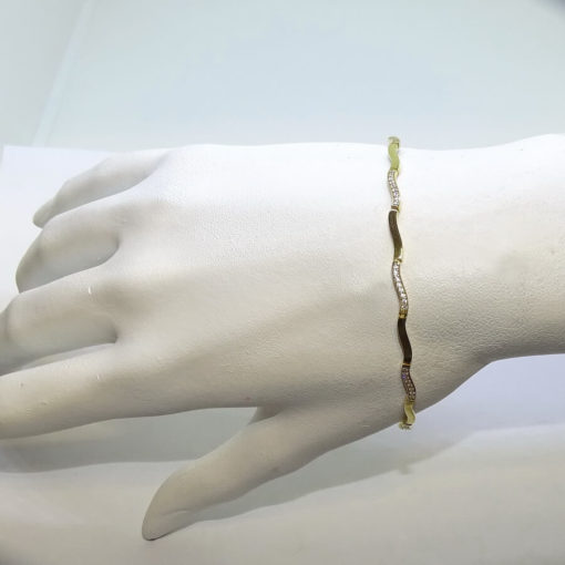 Pulsera de oro amarillo de 18 quilates para mujer con circonitas. Clásica y elegante. - Imagen 2