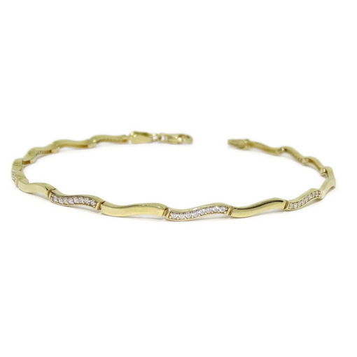 Pulsera de oro amarillo de 18 quilates para mujer con circonitas. Clásica y elegante.