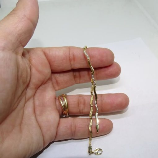 Pulsera de oro amarillo de 18 quilates para mujer con circonitas. Clásica y elegante. - Imagen 6