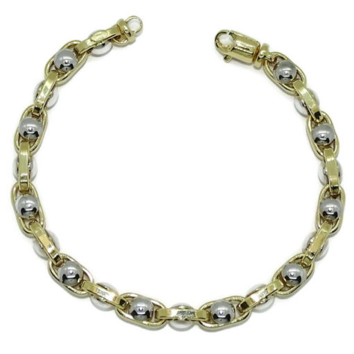 Pulsera para hombre de oro de 18k bicolor, con cadena forzada en oro amarillo y círculos de oro blanco de 18k, 7mm de ancha, largo 21.50cm.