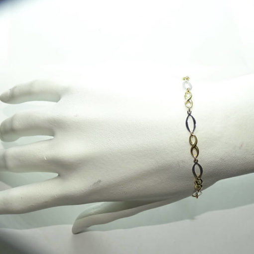 Pulsera de oro amarillo y oro blanco para mujer con infinitos y eslabones ovalados. 19.00cm de larga. - Imagen 2