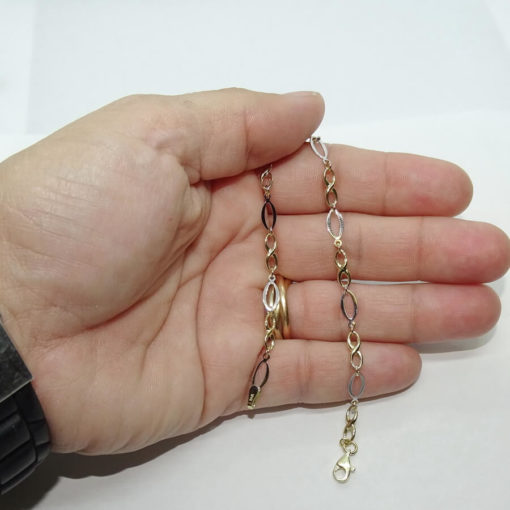 Pulsera de oro amarillo y oro blanco para mujer con infinitos y eslabones ovalados. 19.00cm de larga. - Imagen 6