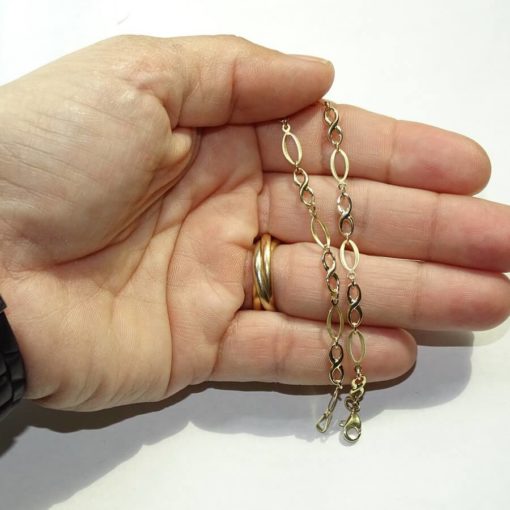 Pulsera de oro amarillo mate y brillo para mujer con infinitos y eslabones ovalados - Imagen 3