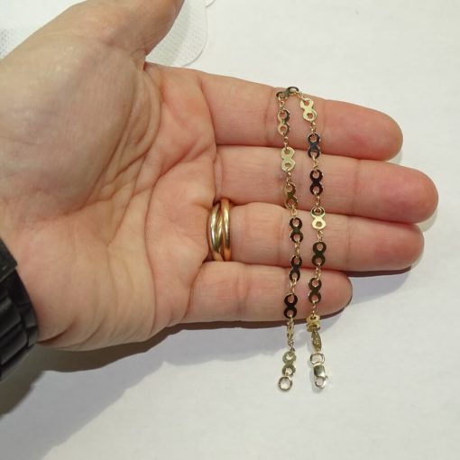 Pulsera de oro amarillo de 18k brillo para mujer con 16 infinitos y eslabones. 19.50cm - Imagen 4