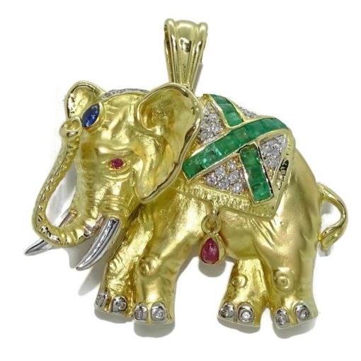 Elefante de oro amarillo de 18k con diamantes y piedras preciosas.