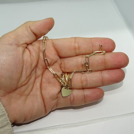 Pulsera de oro amarillo de 18k con eslabones forzados y corazón central. 18.50 cm - Imagen 3