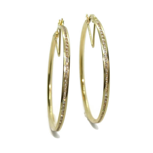Pendientes aros de oro amarillo de 18k con circonitas en carril. - Imagen 6