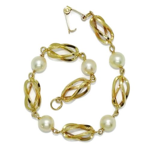 Preciosa, elegante y clásica pulsera de oro amarillo de 18K con 5 perlas cultivadas de 7.00 mm y pulsera tipo reja/jaula unida a mano. - Imagen 6