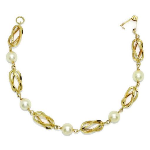 Preciosa, elegante y clásica pulsera de oro amarillo de 18K con 5 perlas cultivadas de 7.00 mm y pulsera tipo reja/jaula unida a mano.