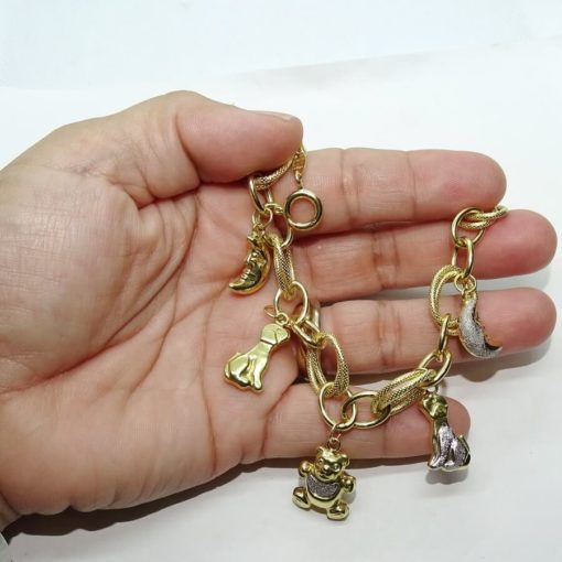 Preciosa y alegre pulsera para mujer de oro amarillo y oro blanco lapidado de 18k con 5 motivos. - Imagen 3
