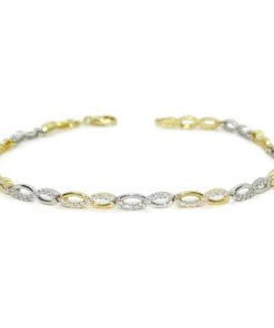Pulsera semi-rígida de oro amarillo y oro blanco de 18k con infinitos y circonitas.