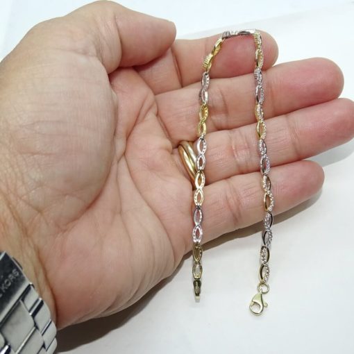 Pulsera semi-rígida de oro amarillo y oro blanco de 18k con infinitos y circonitas. - Imagen 3