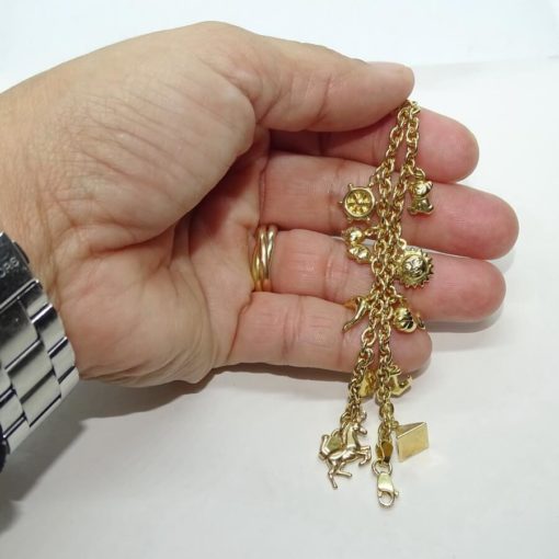 Preciosa y alegre pulsera para mujer de oro amarillo de 18k con 11 motivos y cadena rolo - Imagen 3