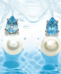 Pendientes con 2 topacios azules engastados con 4 garras en oro blanco de 18k y 2 perlas cultivadas de 7mm.