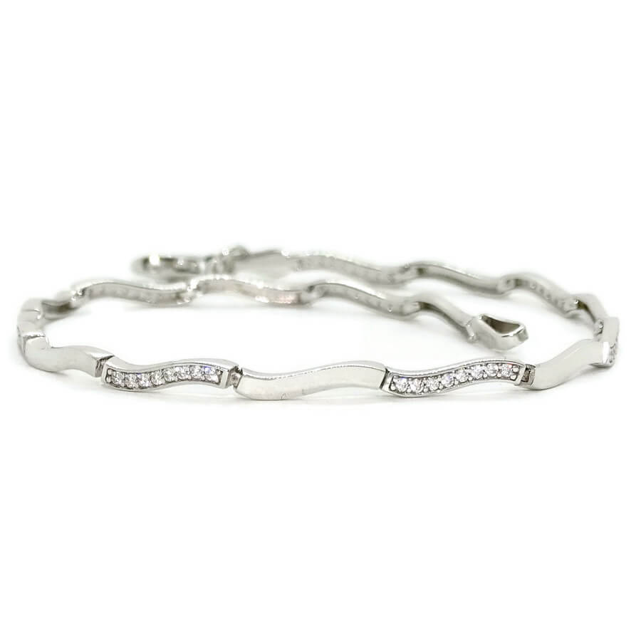 Pulsera oro blanco 18k mujer ondas semi rígida circonitas elegante 19 cm